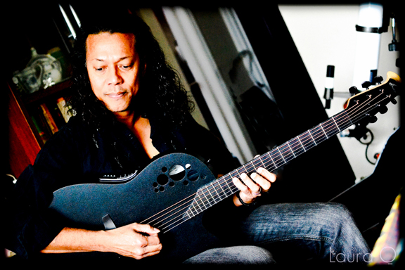 Miguel with black Ovation guitar